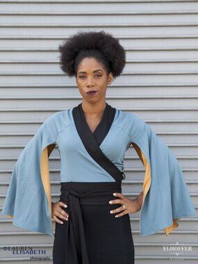 Elhoffer Design Light Blue Wrap Top with Black Trim and Dramatic Cape Sleeves